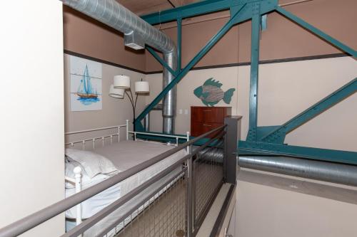a room with a bed on a balcony at Marlin at the Lake - Downtown Sandusky in Sandusky
