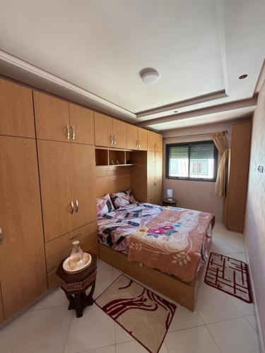 a bedroom with a large bed in a room at Dar AMIRA in Ben Yakhlef