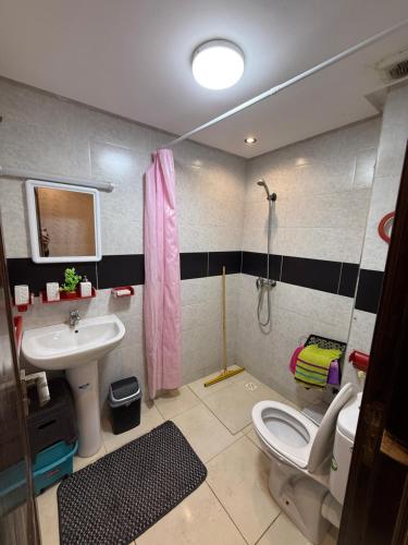 a bathroom with a sink and a toilet and a shower at Dar AMIRA in Ben Yakhlef