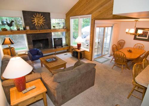 a living room with a couch and a table at 10 Quelah Condo in Sunriver