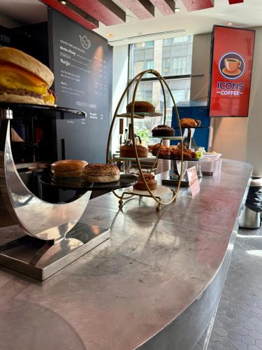 a counter with a display of pastries and pies at Sports Illustrated Resorts Chicago in Chicago
