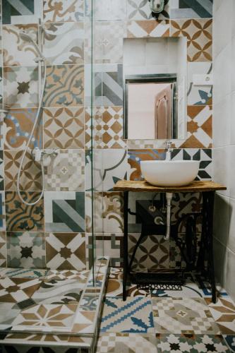 a bathroom with a sink and a mirror at Green Sheep Boutique Hotel in Kazbegi