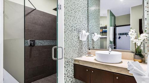 a bathroom with a sink and a shower at Penthouse Oceanview 1 block Malecon bars shops ZR in Puerto Vallarta