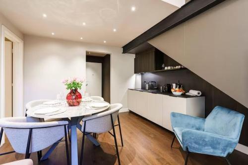 a kitchen and dining room with a table and chairs at Palazzo Venezia in Florence