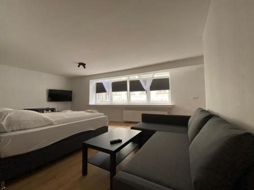 a living room with a couch and a table at Altstadt Kurzestr in Düsseldorf