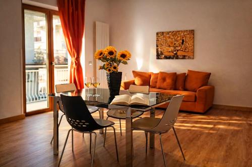 a living room with a glass table and chairs at Casa Annalisa in Scauri