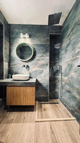 a bathroom with a sink and a mirror at Silia Villas in Ormos Panagias