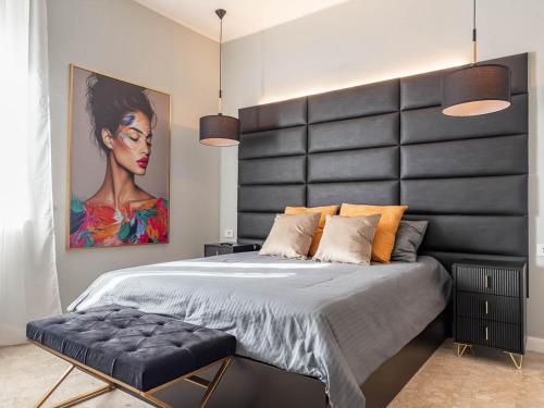 a bedroom with a large bed with a large headboard at MYō in Dorno
