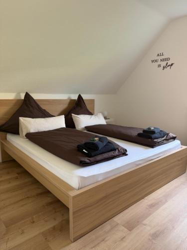 two beds with towels on top of them in a bedroom at Haus87a in Oberkirch