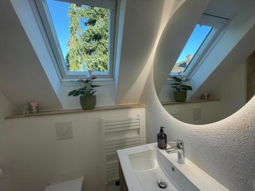 a bathroom with a sink and a mirror at Haus87a in Oberkirch