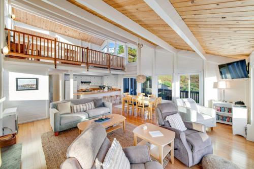 a living room with couches and a dining room at Otter's Rest in Gualala