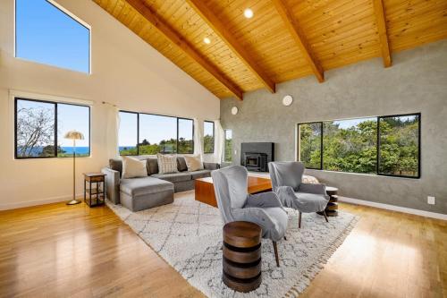 a living room with a couch and a table at SeaRenity in Sea Ranch