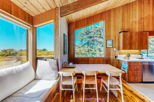 a kitchen and dining room with a table and chairs at Dune Drift in Sea Ranch