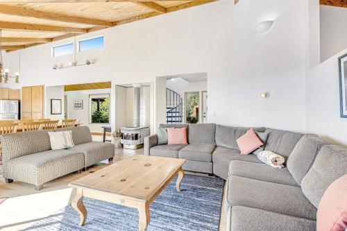 a living room with a couch and a table at Urban Escape Compound in Sea Ranch