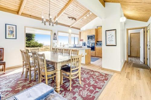 a kitchen and dining room with a table and chairs at Urban Escape Compound in Sea Ranch