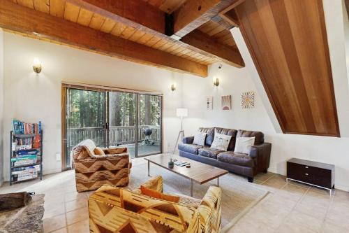 a living room with a couch and a table at Deep Woods Hideaway in Annapolis