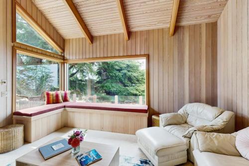 a living room with a couch and a table at Cypress Cove in Sea Ranch