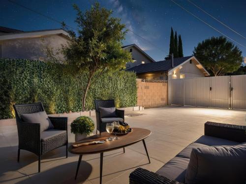 a patio with chairs and a table in a backyard at Private 1BR w Yard & King Bed Simi Valley in Simi Valley