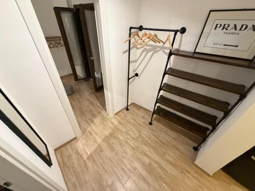 a staircase in a room with a stair case at SUITE LUX apulia in Massafra
