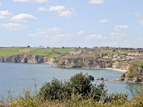 a view of a body of water with a beach at Bluebell in Saint Ewe