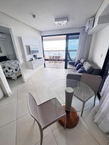 a living room with a couch and chairs at Hotel Platinum - Landscape Luxo - in Fortaleza