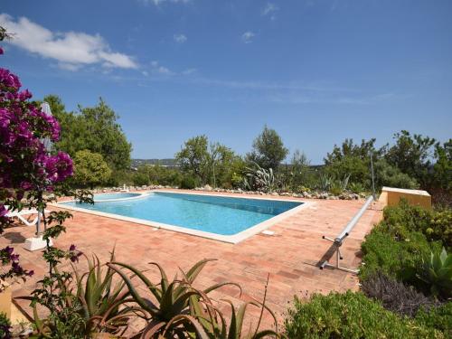 a swimming pool in the middle of a yard at Delightful, authentic Quinta with pool in Loulé