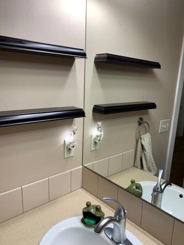 a bathroom with a sink and a mirror at Waterfront home in Gig Harbor