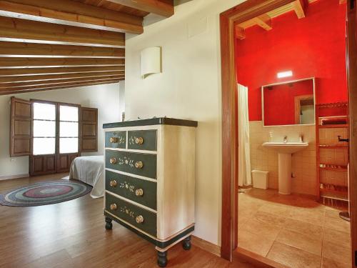 a room with a chest of drawers and a bathroom at Mansion in Nava with Pool & Terrace in Nava