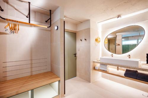 a bathroom with a sink and a mirror at Davinia Hua Hin Resort in Hua Hin