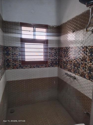 a bathroom with a shower with a window and a sink at Guest house one room 9&&&&So&&2 in Kharar