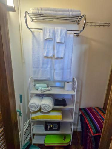 a towel rack in a bathroom with towels at Sand and Sol Rental in Hopkins