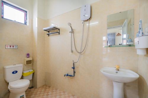 a bathroom with a toilet and a sink at Y's La House in Hoi An