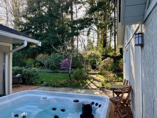 a bath tub on the side of a house at Five Gables B&B in Qualicum Beach
