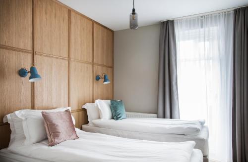 Ένα ή περισσότερα κρεβάτια σε δωμάτιο στο Ódinsvé Hotel Apartments