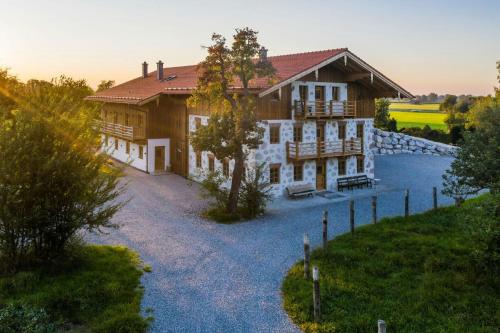 an aerial view of a house with a yard at A Historic Gem With Wellness Comfort in Übersee