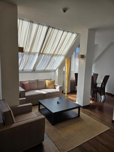 a living room with a couch and a coffee table at MyPlace Premium Apartments in Vienna