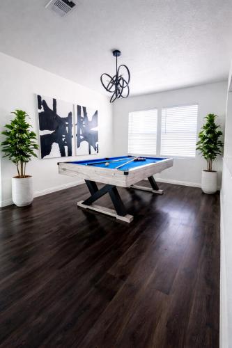 a room with a ping pong table in it at VEGAS GEM 4BDR KING BED Wifi GARAGE PRKNG in Las Vegas