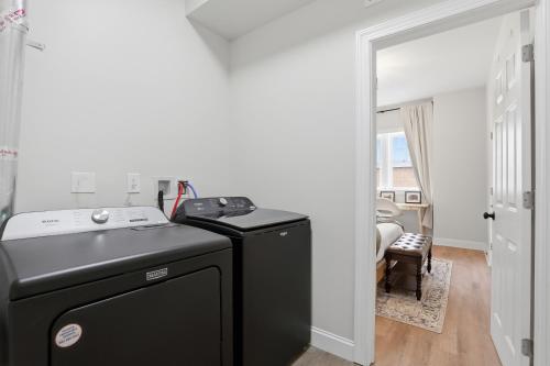 a black washer and dryer in a room at Walk to VA DMC 2BR 2 FULL Baths Midtown in Detroit