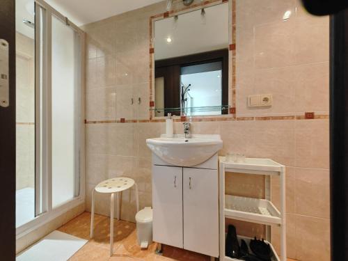 a bathroom with a sink and a mirror at Apartmány 3J in Trutnov