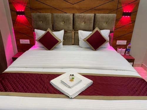 a bedroom with a bed with a tray on it at Hotel Full Moon Night in Dalhousie