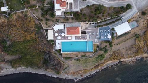 an aerial view of a house next to the water at Birds Bay Resort in Petra