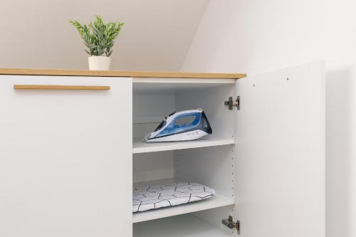 a room with a door open with a toy train on a shelf at Vila Šenčur in Šenčur