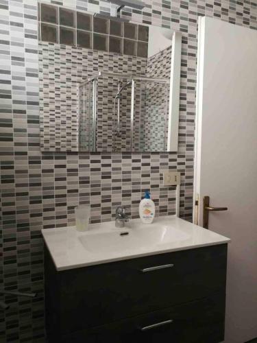 a bathroom with a sink and a mirror at Splendid Lido in Venice-Lido