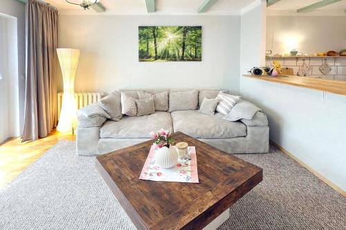 a living room with a couch and a coffee table at Zach Waldglück in Groß Klessow