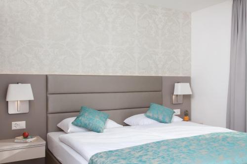 Letto o letti in una camera di CITY STAY - Lindenstrasse