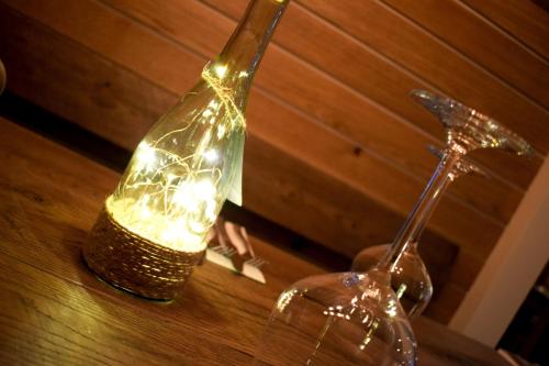 a bottle with lights in it sitting on a table at The Horse & Jockey in Alfreton