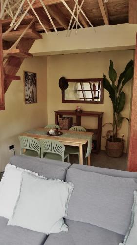 a living room with a table and chairs at Villa Isleñas - Solar, Starlink, Pool in General Luna