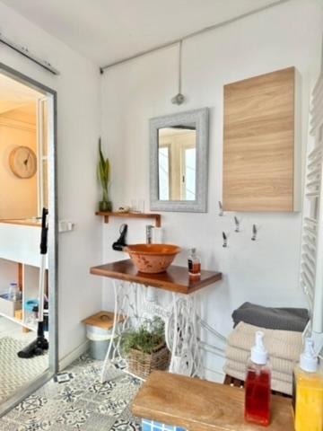 a bathroom with a sink and a mirror at Can PONÇ PARRA in Santanyi