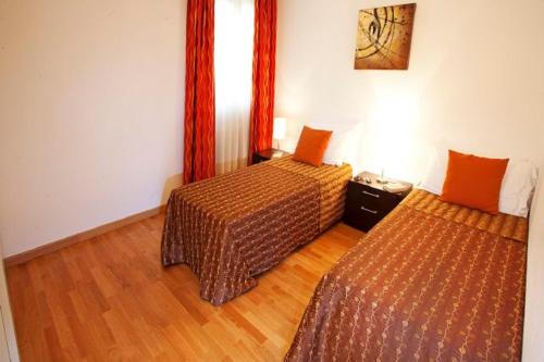 Cama o camas de una habitación en Tremezzo Residence-11 apartments to choose from in an exclusive residence by Italian Apartments