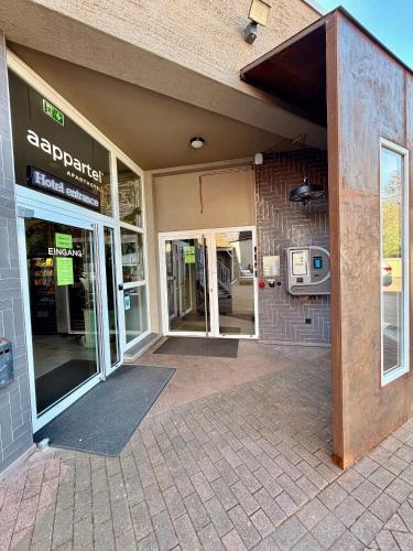 an entrance to a building with a door open at aappartel APARTHOTEL Herford in Herford